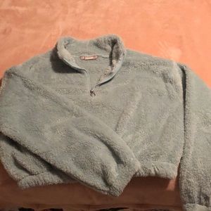 Fuzzy light green sweater half top zip up. NWOT.